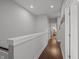 Bright hallway with hardwood floors, white trim, and fresh gray paint throughout the house at 357 Parkway Ave, Indianapolis, IN 46225