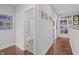 Hallway with unique bathroom access and art adorned walls at 357 Parkway Ave, Indianapolis, IN 46225