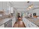 Elegant kitchen with granite counters, stainless appliances, and a seamless flow to the dining area at 357 Parkway Ave, Indianapolis, IN 46225
