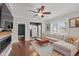 Bright and airy living room with a fireplace, hardwood floors, and neutral decor at 357 Parkway Ave, Indianapolis, IN 46225