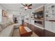 Inviting living room featuring hardwood floors, a fireplace, and open access to the kitchen at 357 Parkway Ave, Indianapolis, IN 46225