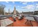 Spacious rooftop deck with outdoor furniture, perfect for entertaining and enjoying city views at 357 Parkway Ave, Indianapolis, IN 46225