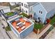 An aerial view showcasing a rooftop deck perfect for entertaining with multiple seating and dining areas at 357 Parkway Ave, Indianapolis, IN 46225