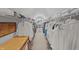 Spacious walk-in closet with ample hanging space and shelving for organized storage and attic access at 357 Parkway Ave, Indianapolis, IN 46225