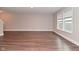 Finished basement with wood floors and large windows at 3930 Towhees Dr, Indianapolis, IN 46237