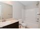 Bathroom with a single sink vanity, toilet, and tub with a shower head at 3930 Towhees Dr, Indianapolis, IN 46237