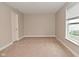 Bedroom featuring plush carpeting, a window, and neutral paint at 3930 Towhees Dr, Indianapolis, IN 46237