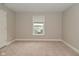 A light and airy bedroom with neutral walls, carpet flooring and a window with blinds at 3930 Towhees Dr, Indianapolis, IN 46237