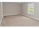 Bedroom featuring plush carpeting and a bright window at 3930 Towhees Dr, Indianapolis, IN 46237