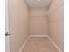 Walk-in closet with carpet floors, wire shelving, and neutral walls at 3930 Towhees Dr, Indianapolis, IN 46237