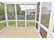 Enclosed screened patio with view of fenced yard, perfect for outdoor living at 3930 Towhees Dr, Indianapolis, IN 46237