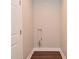 Utility closet showcasing basic plumbing hardware and wood-look flooring at 3930 Towhees Dr, Indianapolis, IN 46237