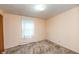 Bedroom with carpet, one window with curtain, and standard closet at 415 S East St, Plainfield, IN 46168