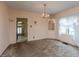 Traditional dining room with a chandelier, corner cabinet, and carpet flooring at 415 S East St, Plainfield, IN 46168