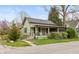 Charming single-story home with a covered front porch, landscaping, and inviting curb appeal at 415 S East St, Plainfield, IN 46168
