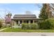 Charming single-story home with a covered front porch, landscaping, and inviting curb appeal at 415 S East St, Plainfield, IN 46168