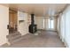 Spacious living room with a cozy fireplace, carpet and large windows for natural light at 415 S East St, Plainfield, IN 46168