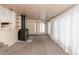 Spacious living room featuring a fireplace, carpet and large windows with curtains at 415 S East St, Plainfield, IN 46168