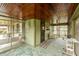 Relaxing screened porch with wood ceiling, seating, and an open view of the outdoors at 415 S East St, Plainfield, IN 46168
