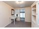 Bright room featuring neutral tones, a desk, carpeted floors, and a built-in cabinet for optimal storage at 415 S East St, Plainfield, IN 46168