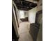 Basement room under repair, featuring a window and exposed utilities awaiting restoration at 4206 Clark St, Anderson, IN 46013