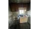 Unfinished kitchenette with cabinets and sink awaiting finishing touches for a cozy space at 4206 Clark St, Anderson, IN 46013