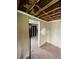 Partially renovated room with exposed framing, offering an opportunity for a personalized interior design at 4206 Clark St, Anderson, IN 46013