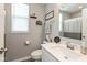 Well-lit bathroom showcasing a vanity with modern fixtures, framed mirror, and bath and shower combo at 4333 Ironclad Dr, Bargersville, IN 46106