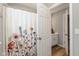 Bathroom featuring modern fixtures, white trim, and a decorative shower curtain at 4333 Ironclad Dr, Bargersville, IN 46106