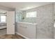 Modern bathroom with walk-in shower, rain shower head, and white marble tile at 4333 Ironclad Dr, Bargersville, IN 46106