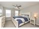 Cozy bedroom with a ceiling fan, plush carpet, and natural lighting at 4333 Ironclad Dr, Bargersville, IN 46106