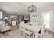 A dining room opens to the kitchen and Gathering room, and features a neutral palette at 4333 Ironclad Dr, Bargersville, IN 46106