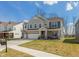 Charming two-story home featuring a well-manicured lawn and welcoming front porch at 4333 Ironclad Dr, Bargersville, IN 46106