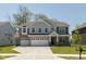 Charming two-story home with a three-car garage, stone accents, and well-manicured front lawn at 4333 Ironclad Dr, Bargersville, IN 46106