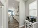 Hallway leading to the dining room and kitchen, showcases natural light and neutral decor at 4333 Ironclad Dr, Bargersville, IN 46106
