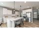 Stylish kitchen with white cabinets, stainless steel appliances, and a center island with bar seating at 4333 Ironclad Dr, Bargersville, IN 46106