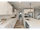 Spacious kitchen featuring white cabinets, an island with a sink, and stainless steel appliances at 4333 Ironclad Dr, Bargersville, IN 46106