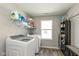 Well-organized laundry room with washer, dryer, and ample storage space at 4333 Ironclad Dr, Bargersville, IN 46106