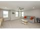 Spacious bonus room with large windows and a comfortable sofa at 4333 Ironclad Dr, Bargersville, IN 46106
