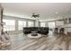 Open concept living room boasts a large sectional and flows into the kitchen and dining room at 4333 Ironclad Dr, Bargersville, IN 46106