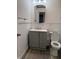 Updated bathroom featuring a gray vanity, toilet, and modern fixtures at 5209 S Bancroft St, Indianapolis, IN 46237