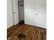 This bedroom has hardwood floors and a large closet for ample storage space at 5209 S Bancroft St, Indianapolis, IN 46237