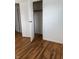 This bedroom features hardwood flooring and closet space for storage solutions at 5209 S Bancroft St, Indianapolis, IN 46237