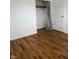 Bright bedroom featuring hardwood floors and a closet with ample storage space at 5209 S Bancroft St, Indianapolis, IN 46237