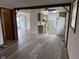 Spacious open-concept kitchen with stainless steel appliances and durable laminate flooring at 5209 S Bancroft St, Indianapolis, IN 46237