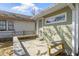 A rear wooden deck with built-in seating offers a space to relax in a tranquil outdoor environment at 525 S Keystone Ave, Indianapolis, IN 46203