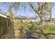 A large backyard with scattered trees and a neighbor's home at 525 S Keystone Ave, Indianapolis, IN 46203