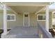 The exterior of the home features a nice, shaded front porch at 525 S Keystone Ave, Indianapolis, IN 46203
