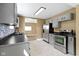 Featuring stainless appliances and seamless access into the living room, this kitchen is a chef's dream at 525 S Keystone Ave, Indianapolis, IN 46203