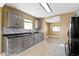 A well-designed kitchen with painted cabinets, modern appliances, and sleek countertops at 525 S Keystone Ave, Indianapolis, IN 46203
